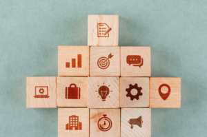 1e28e8a6-business-strategy-concept-with-wooden-blocks-with-icons-1. Png